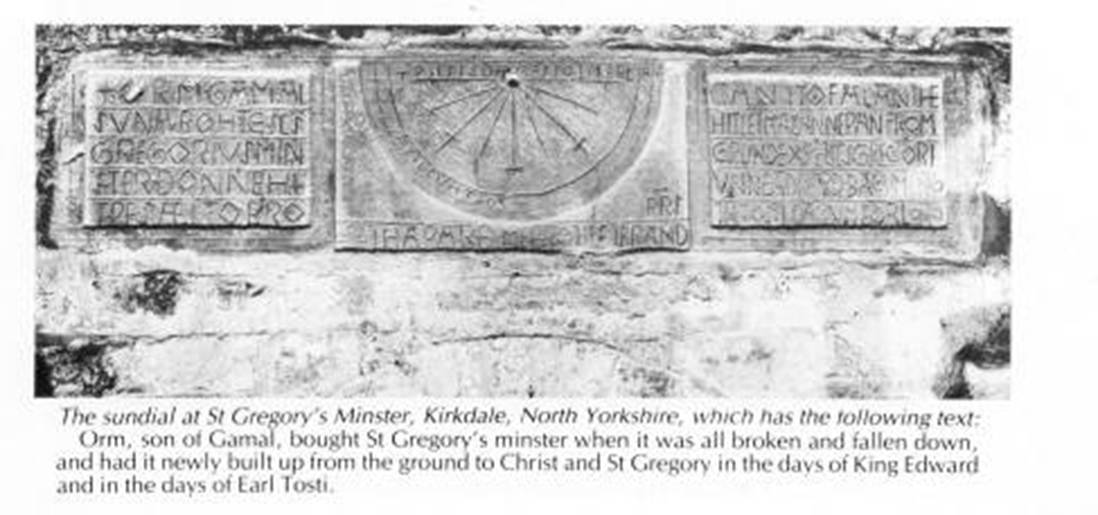 A stone wall with a sundial
Description automatically generated
